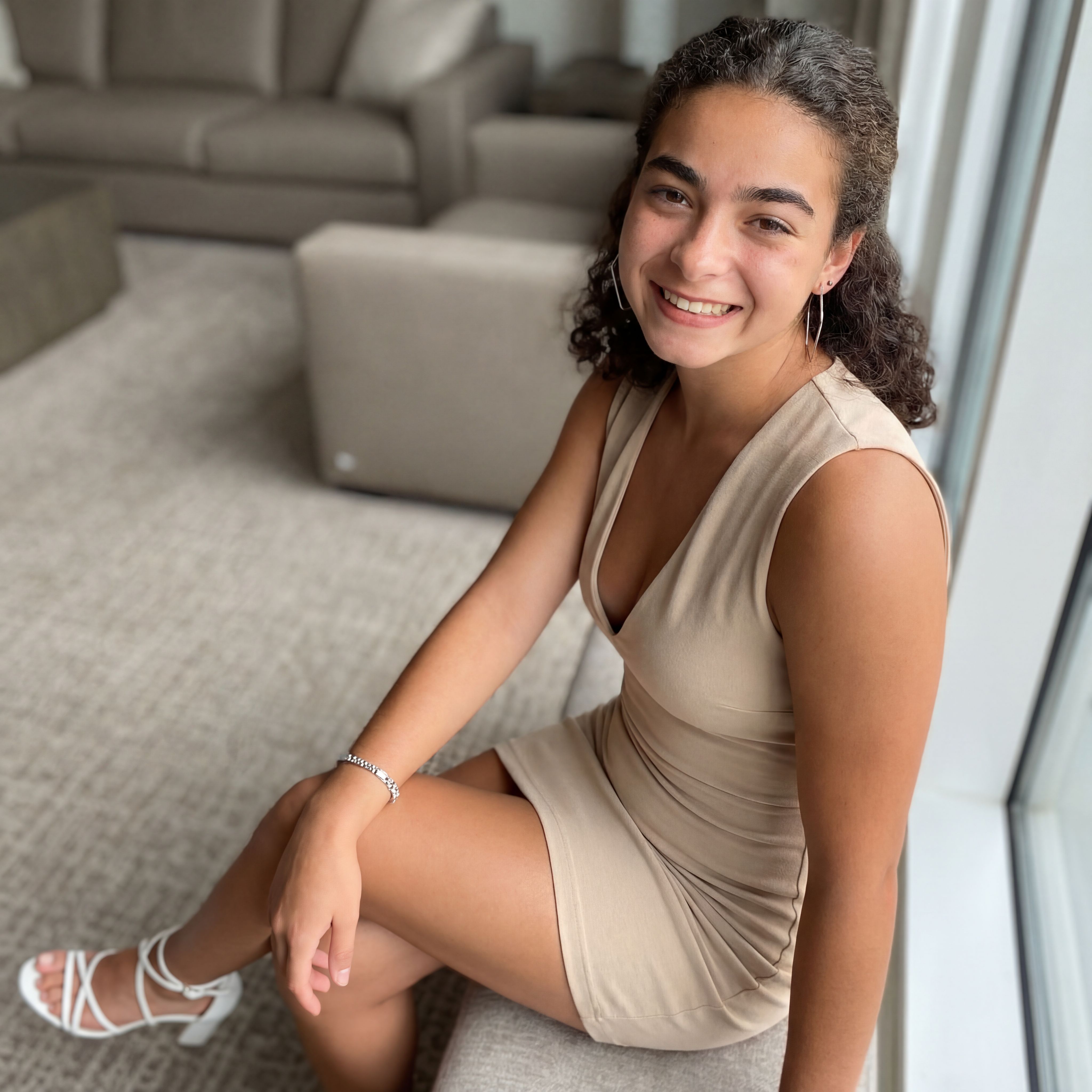 Nano Banana prompt: warm, inviting smile. She wears a for...